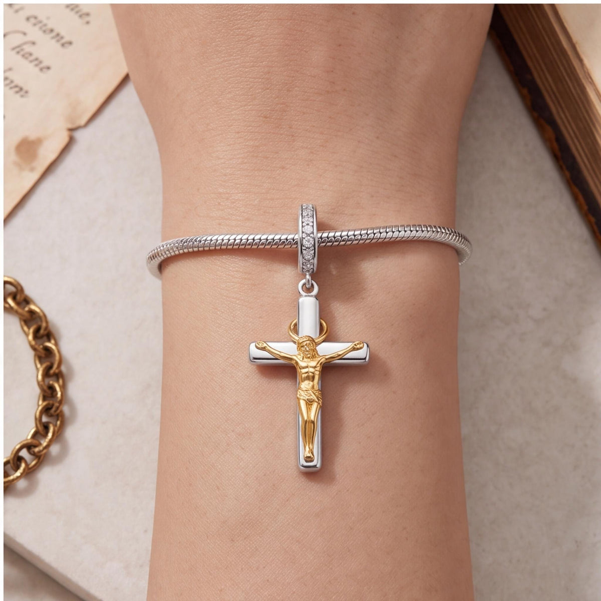 Crucifix Dangle Charm close-up on a bracelet