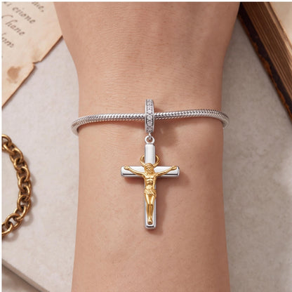 Crucifix Dangle Charm close-up on a bracelet