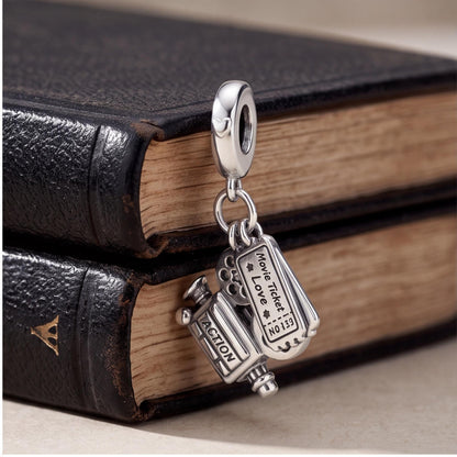 Cinema Dangle Charm styled as a gift