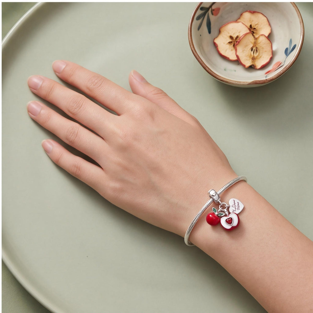 Red Apple Dangle Charm worn on a charm bracelet
