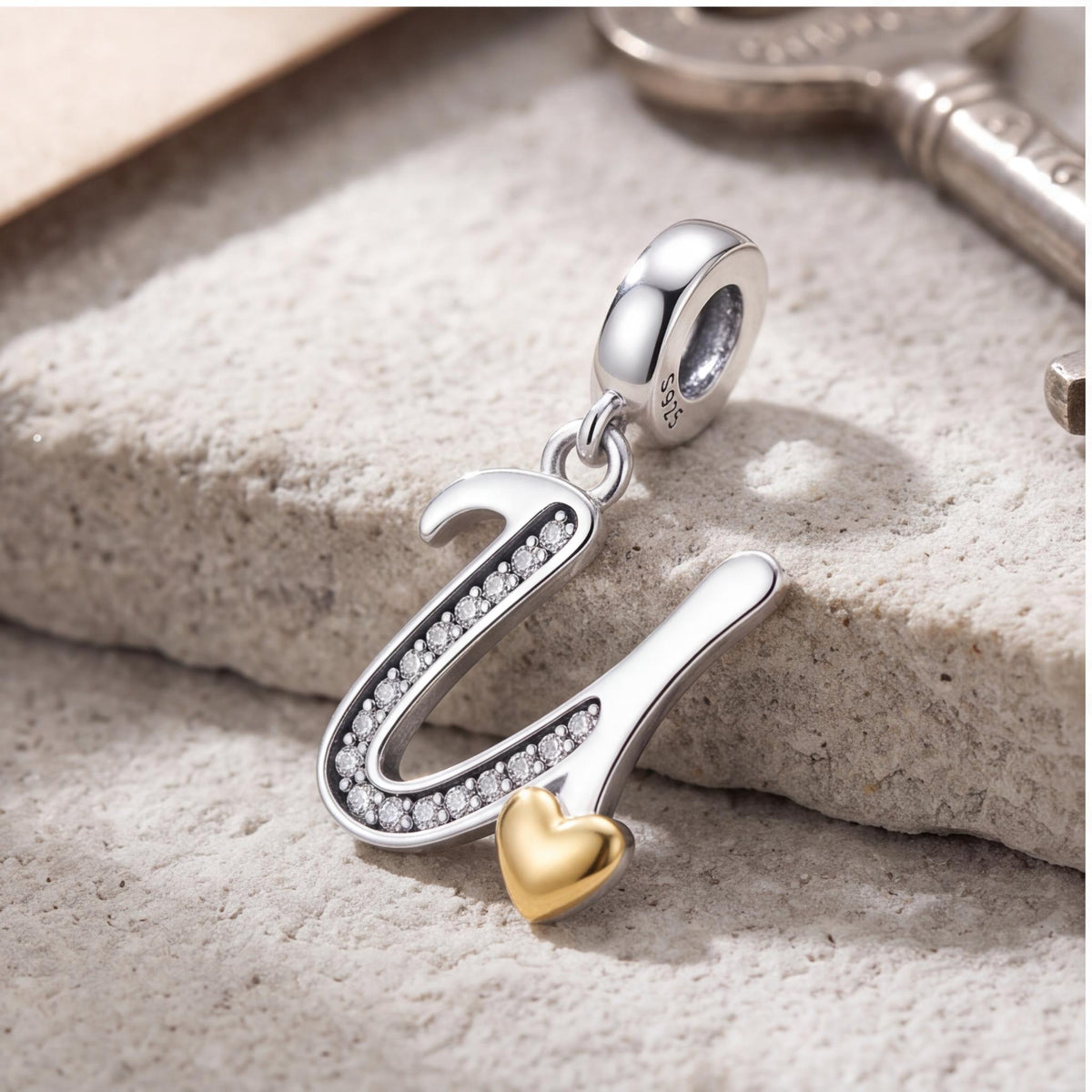Letter U Dangle Charm on a silver charm bracelet