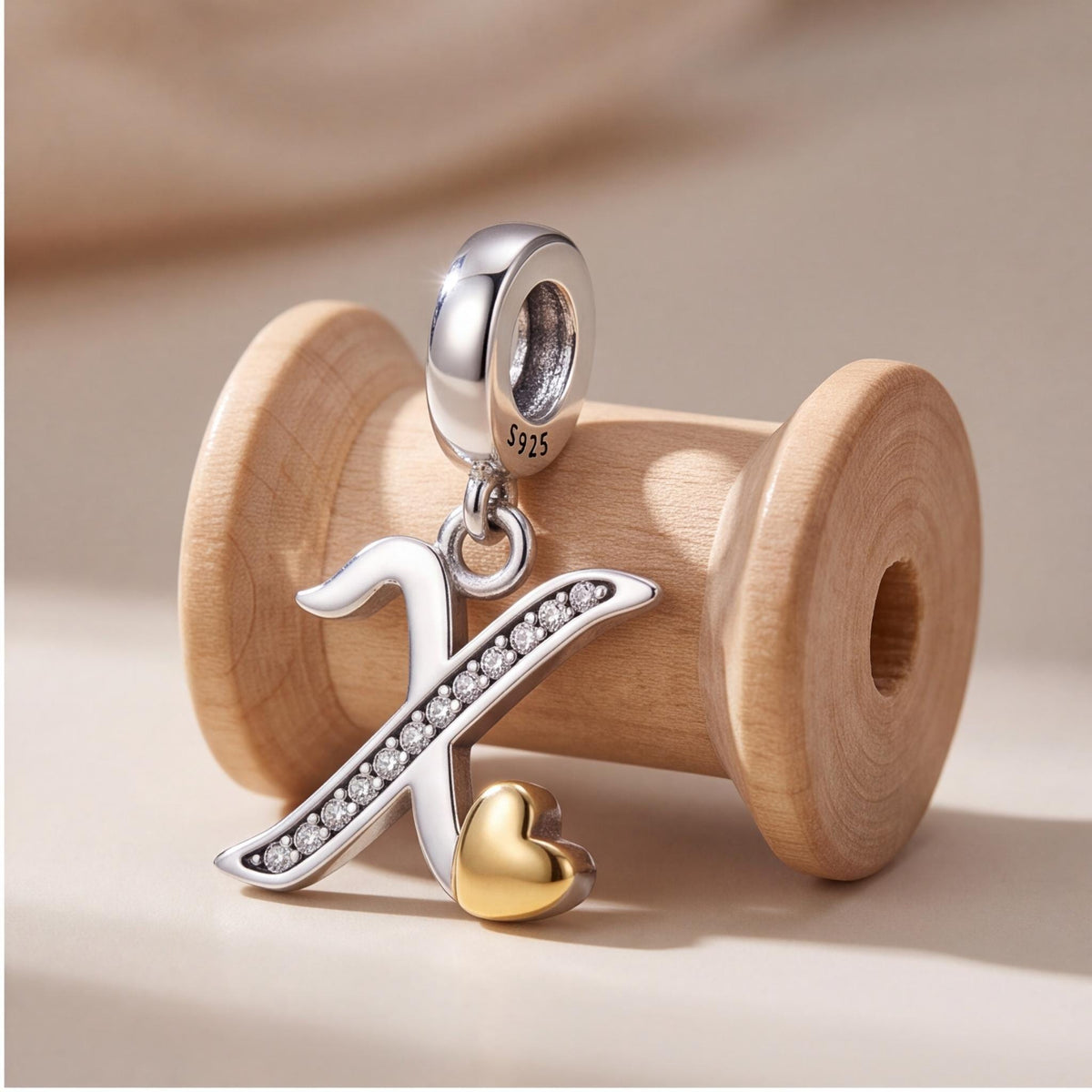 Letter X Initial Charm styled as a gift