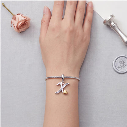 Letter X Initial Charm close-up on a bracelet