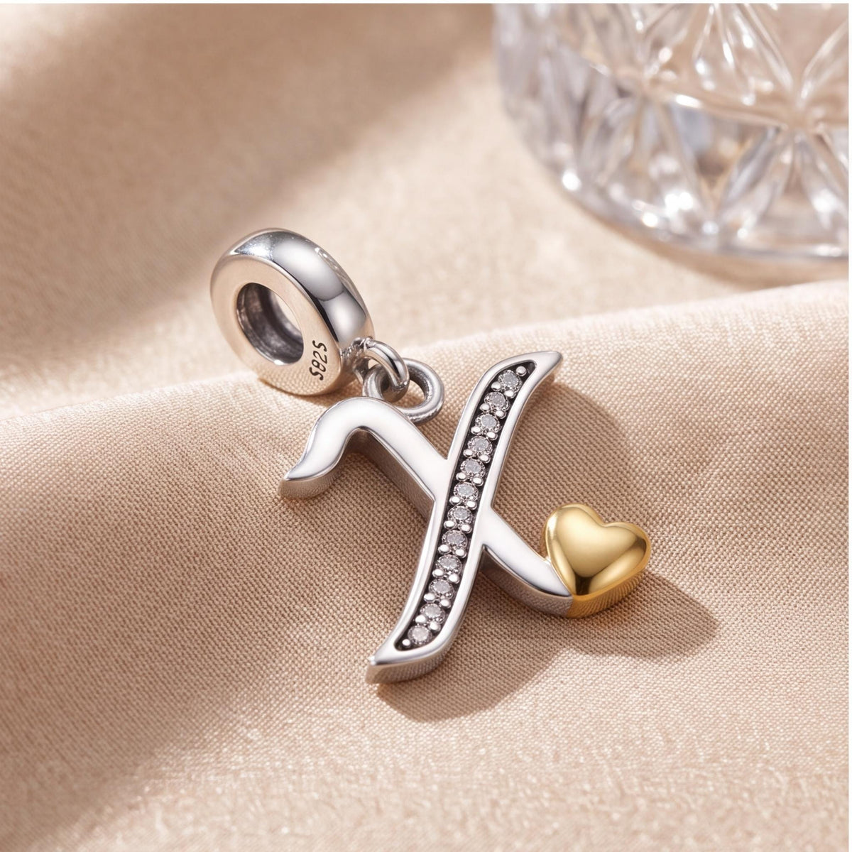 Letter X Initial Charm on a silver charm bracelet