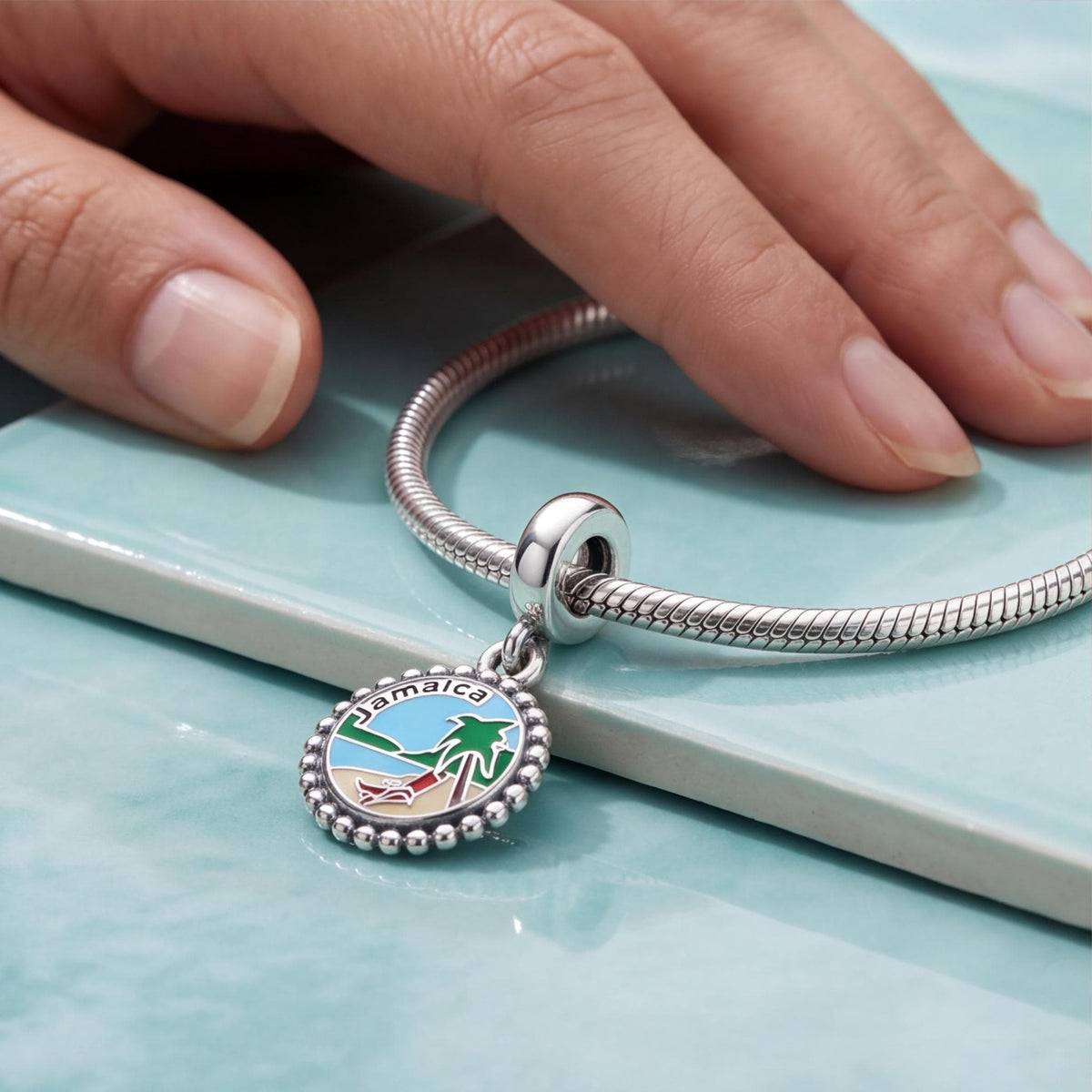 Jamaica Beach Scene Dangle worn on a charm bracelet