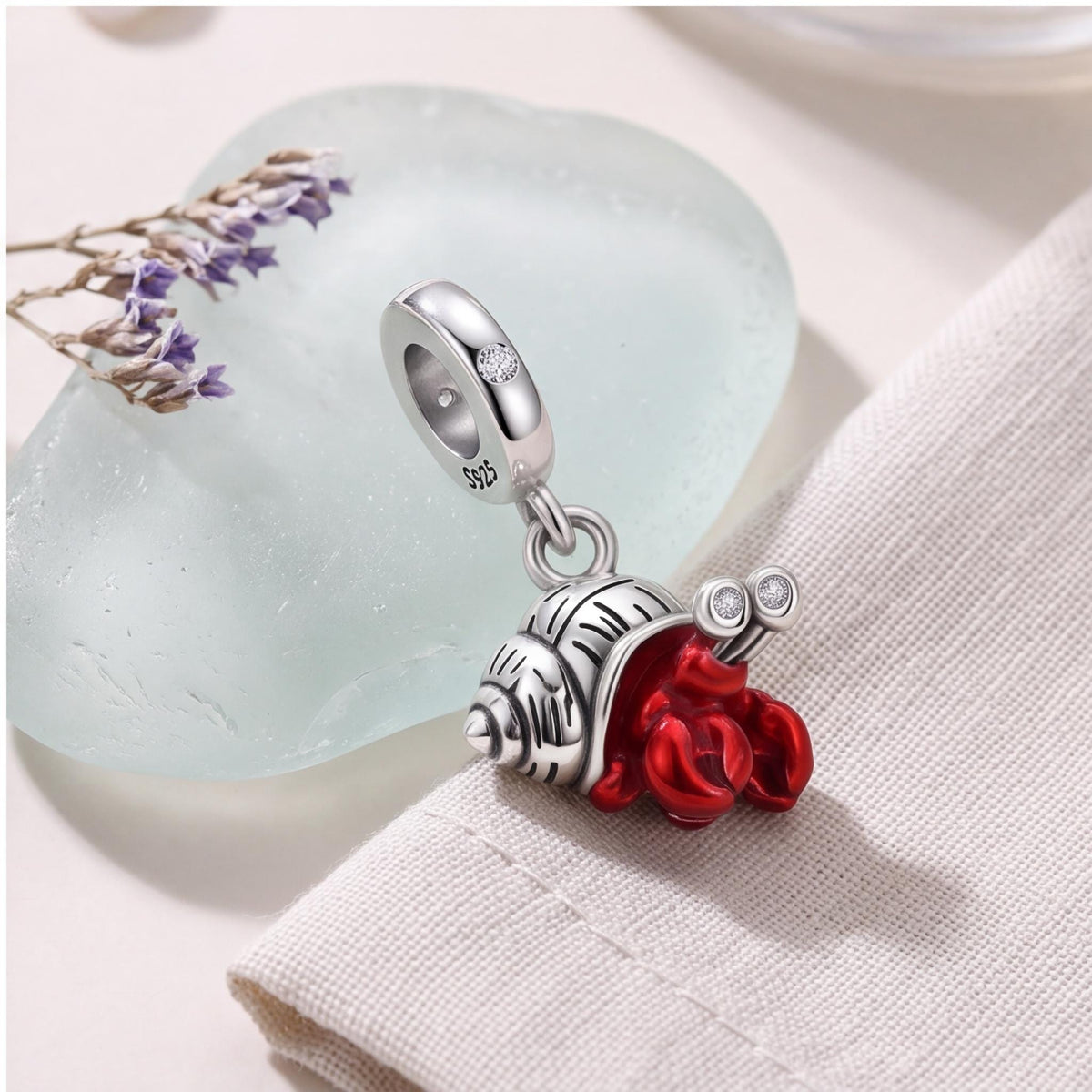 Hermit Crab Charm on a silver charm bracelet