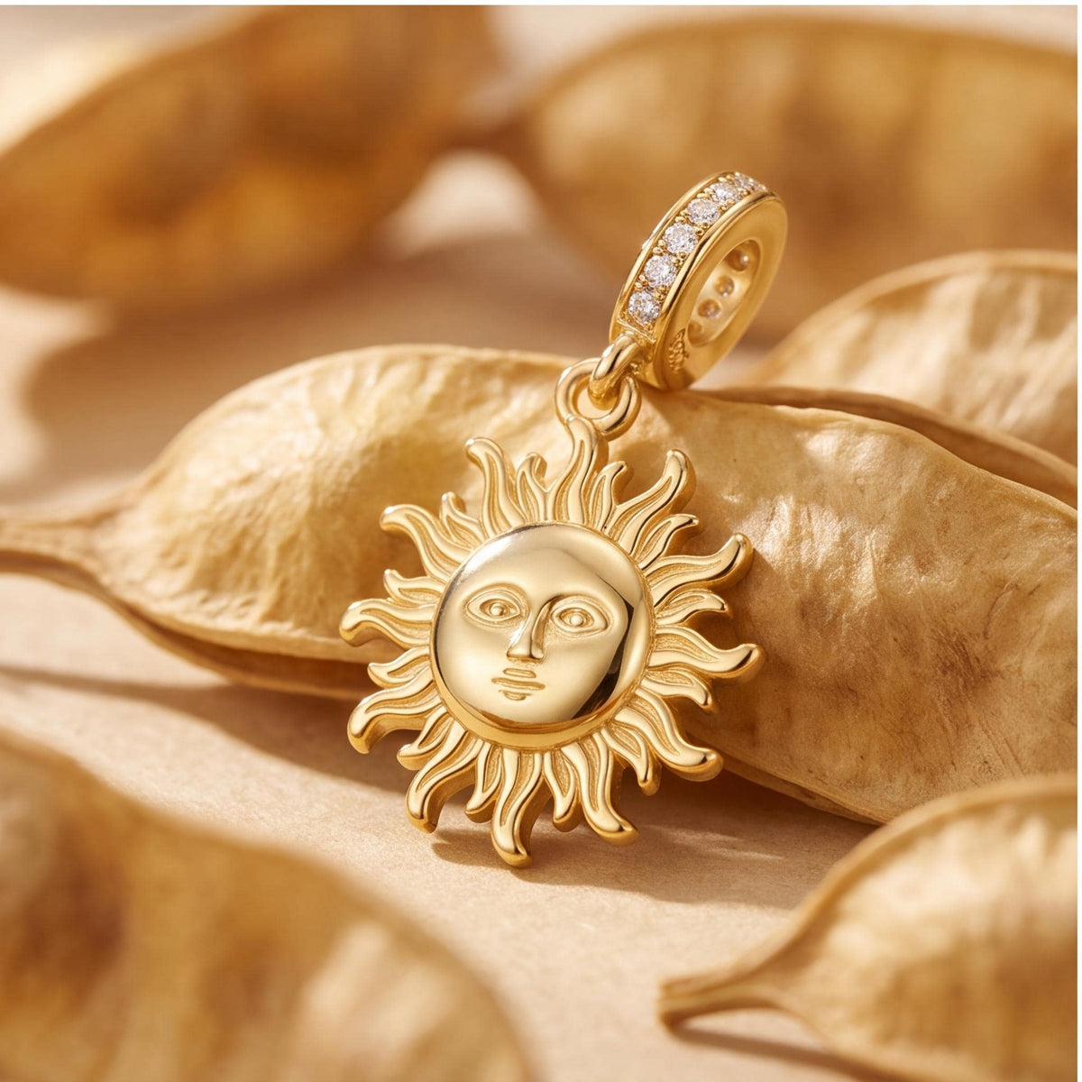 Sun Face Dangle Charm on a silver charm bracelet