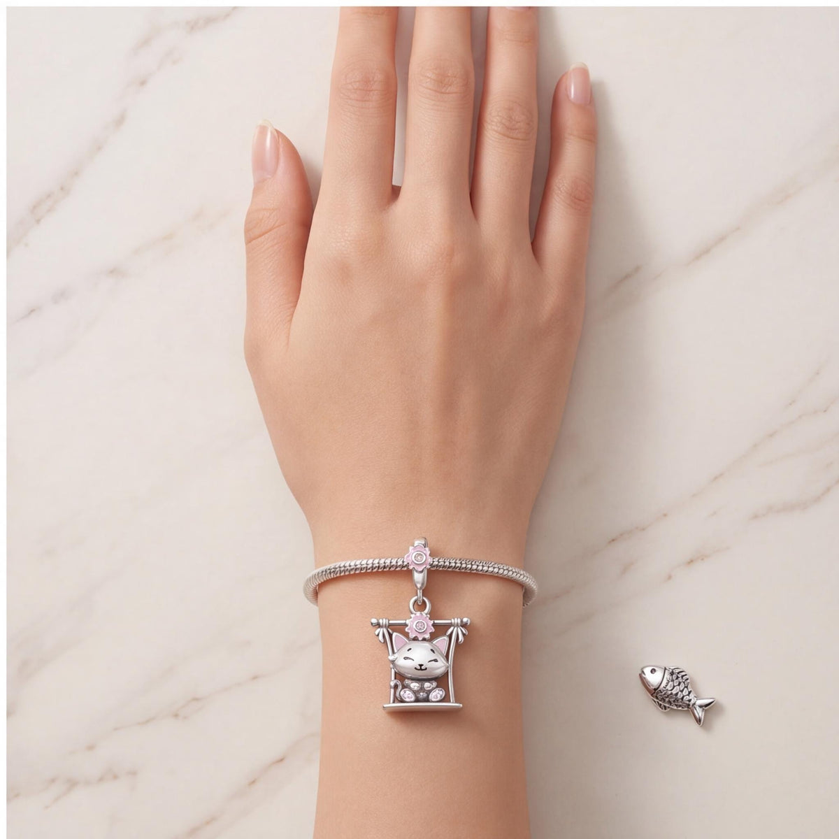 Swing Cat Dangle Charm worn on a charm bracelet