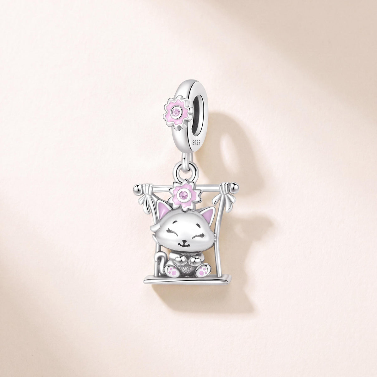 Swing Cat Dangle Charm in 925 sterling silver with pink enamel and sparkling stones, fits European-style charm bracelets