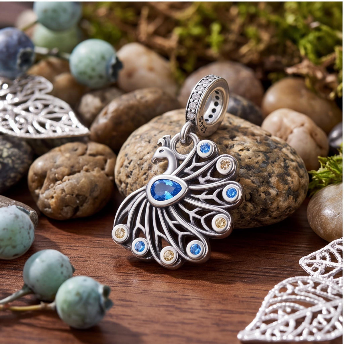 Peacock Dangle Charm on a silver charm bracelet