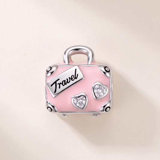 Pink Travel Suitcase Charm in 925 sterling silver with pink and white enamel and sparkling stones