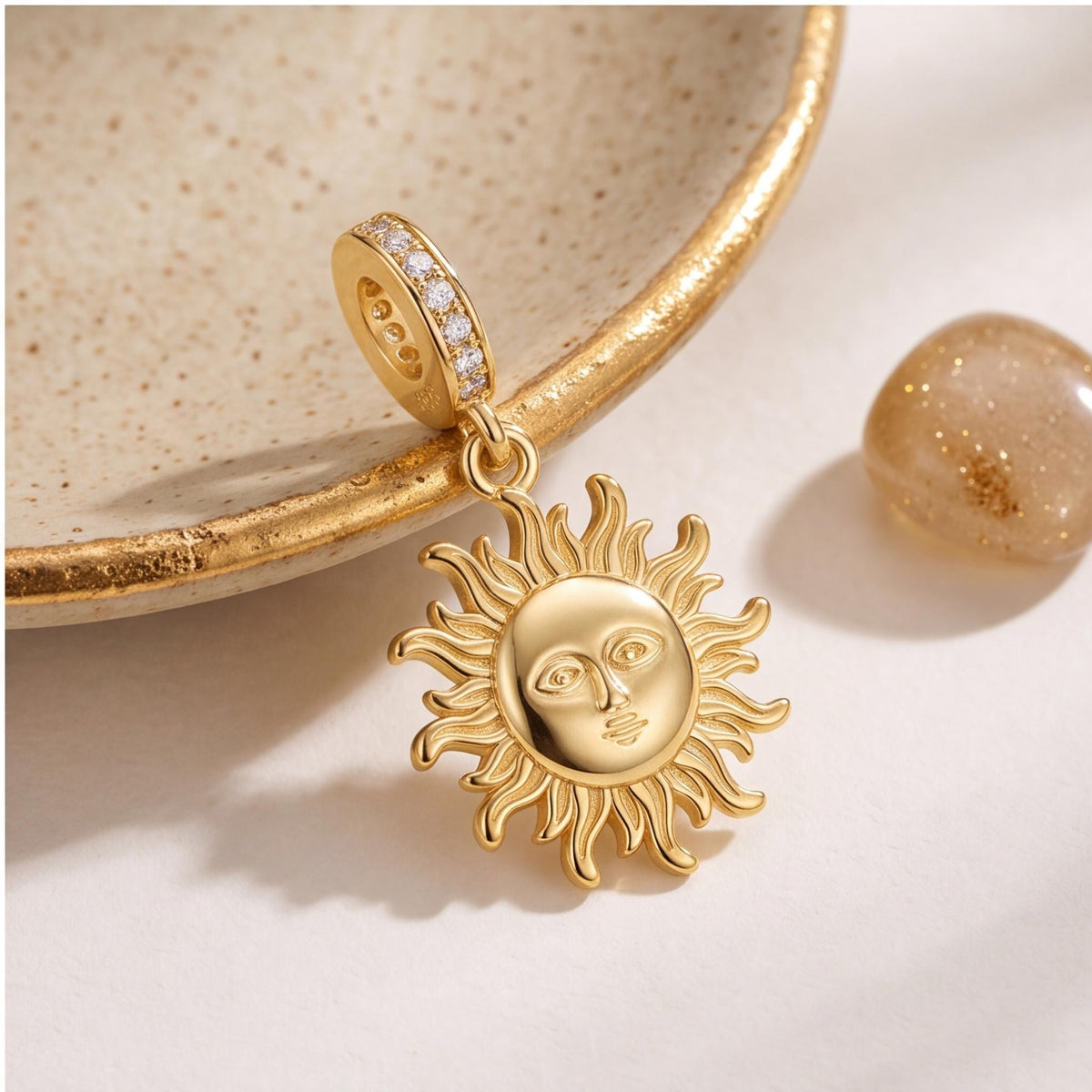 Sun Face Dangle Charm styled as a gift
