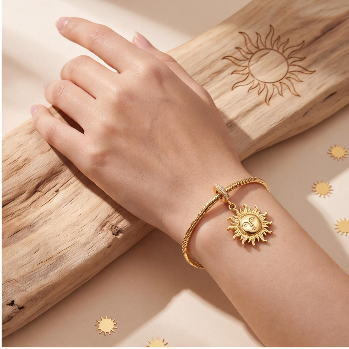 Sun Face Dangle Charm worn on a charm bracelet