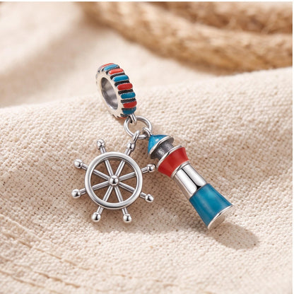 Lighthouse Ship Wheel Dangle styled as a gift