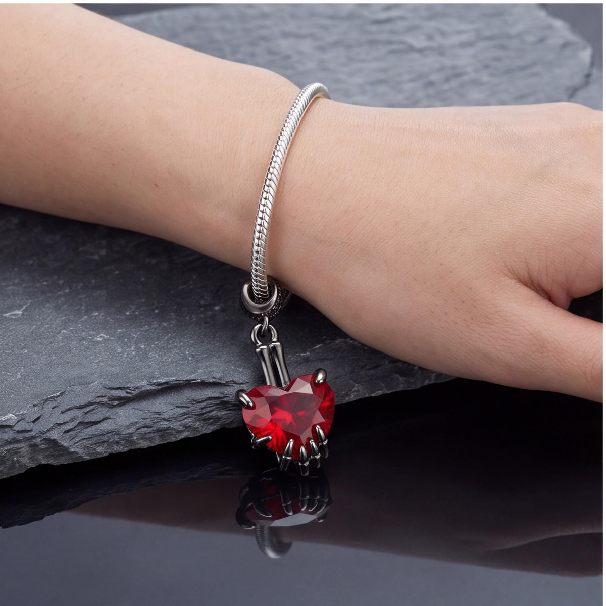 Skeleton Hand Heart Dangle close-up on a bracelet