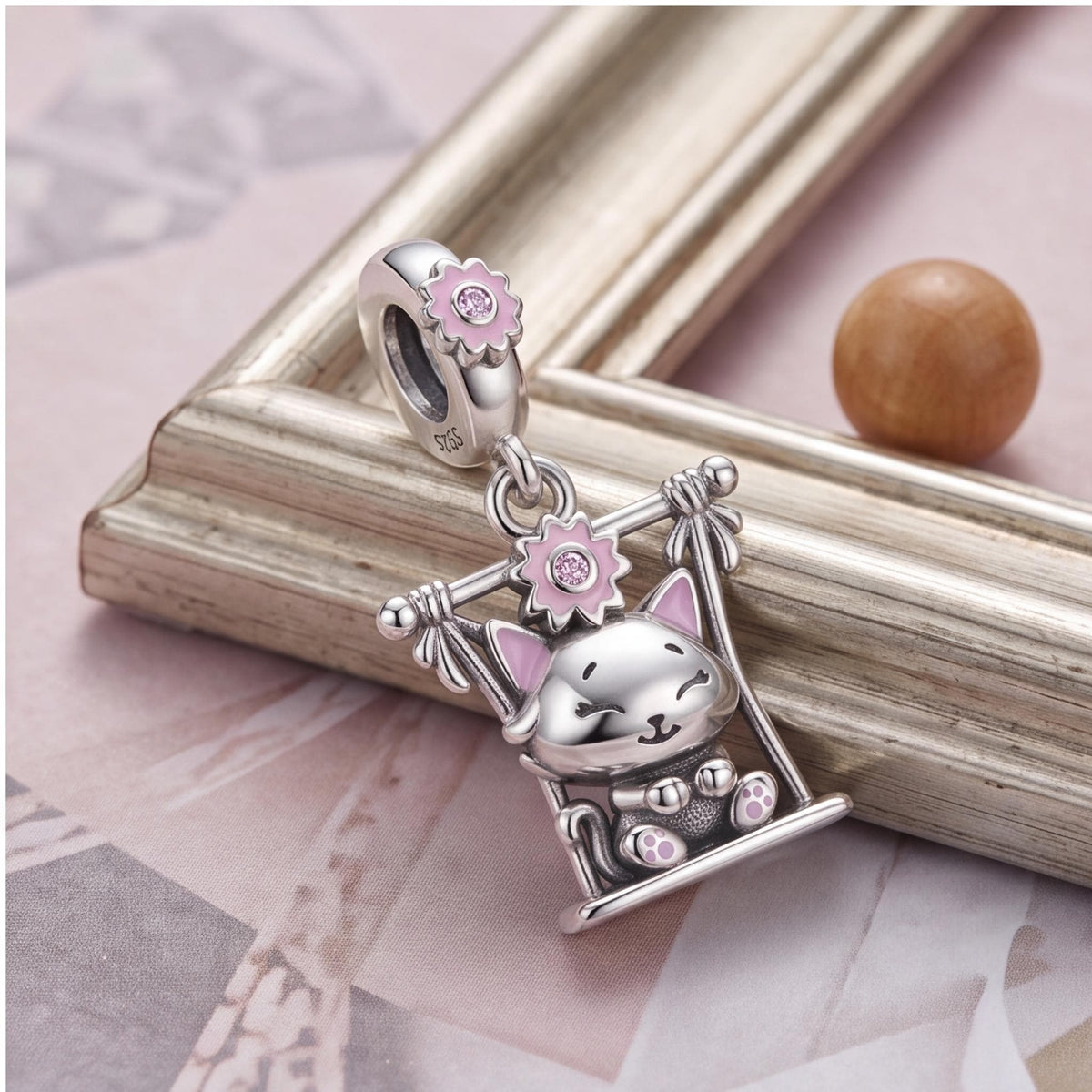 Swing Cat Dangle Charm styled as a gift