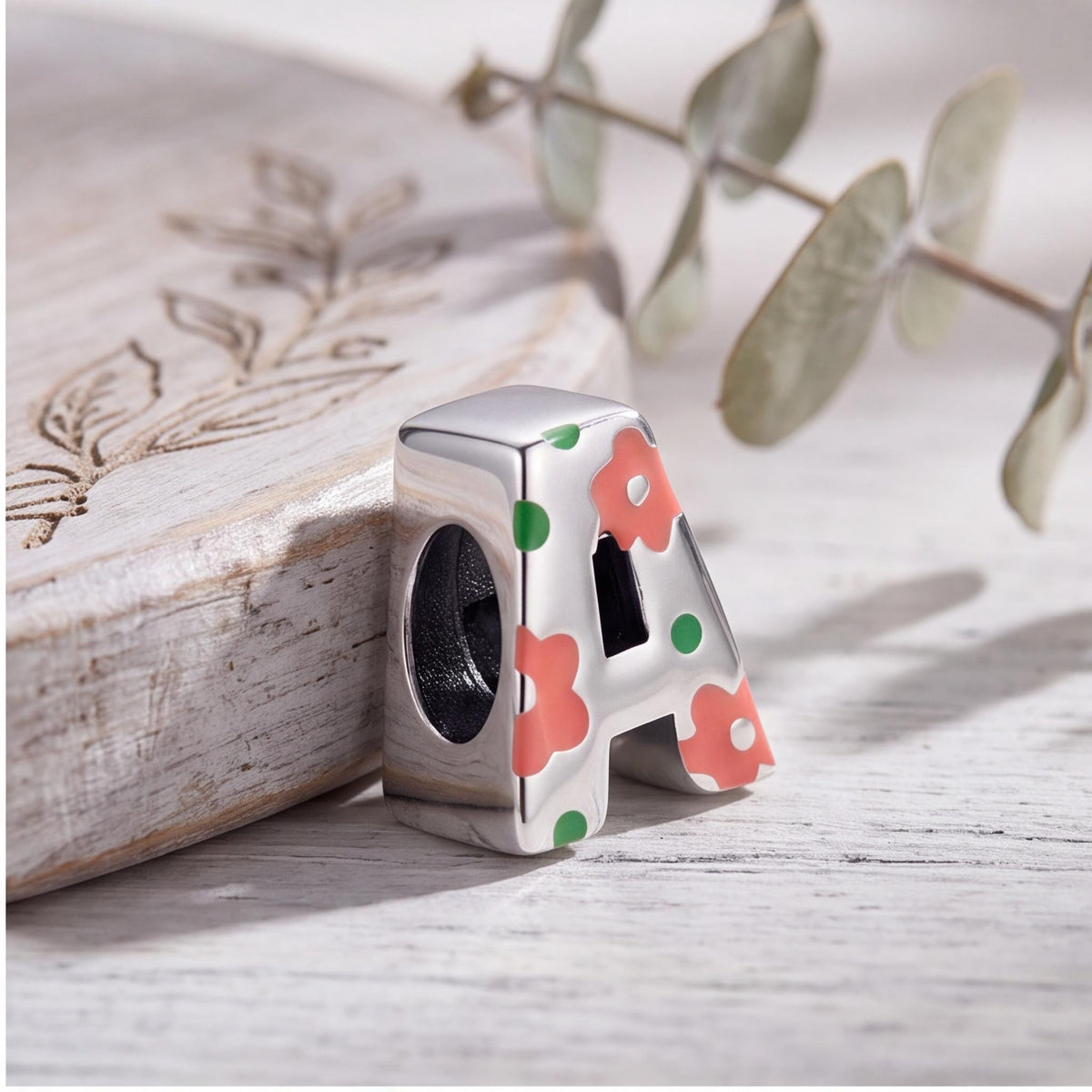 Floral Letter A Charm on a silver charm bracelet